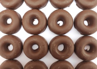 Many chocolate donuts or donuts together
