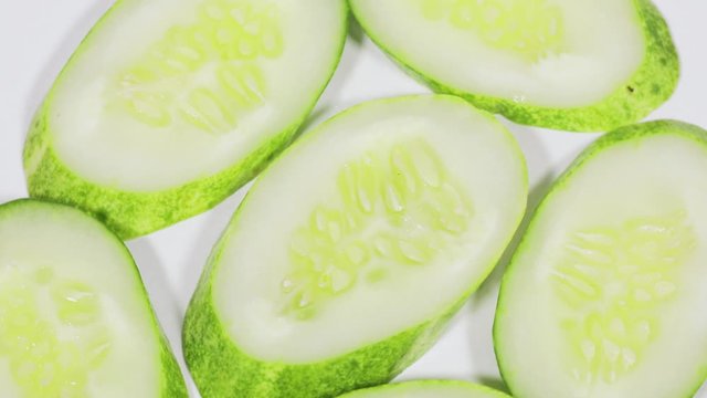 Close up of sliced fresh green cucumber on table