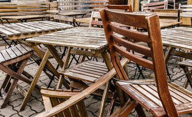 Wooden chairs and tables stored, locked and chained early morning