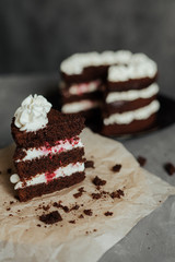 Chocolate cake with cream and raspberries. Cut piece