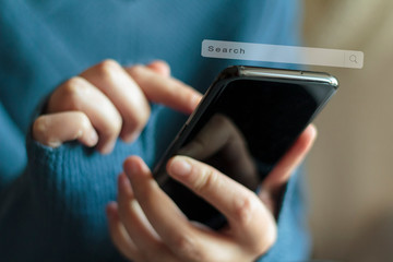 Woman searching information data on smartphone