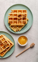 sweet waffles with honey top view flat lay
