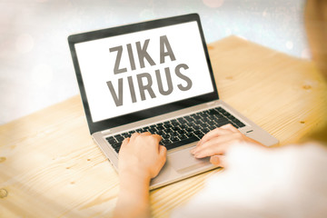Writing note showing Zika Virus. Business concept for caused by a virus transmitted primarily by...