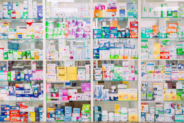 Fototapeta na wymiar counter store table pharmacy background shelf blurred blur focus drug medical shop drugstore medication blank medicine pharmaceutics.