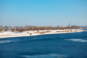 early spring scenery with melting ice on the  river