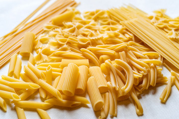 Variety of types and shapes of dry Italian pasta