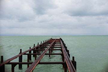 eashore in cloudy weather with sky covered by clouds
