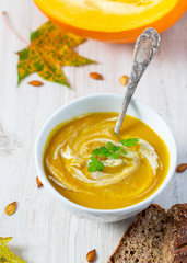 pumpkin soup on wooden surface