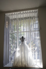 wedding dresses displayed in window showcase