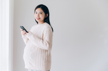 Portrait of young Asian pregnant woman