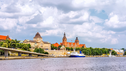Cruise ship docked on Rampart of Brave embankment. National Museum and West Pomeranian Regional Authority and Passport Office in background, Szczecin - obrazy, fototapety, plakaty