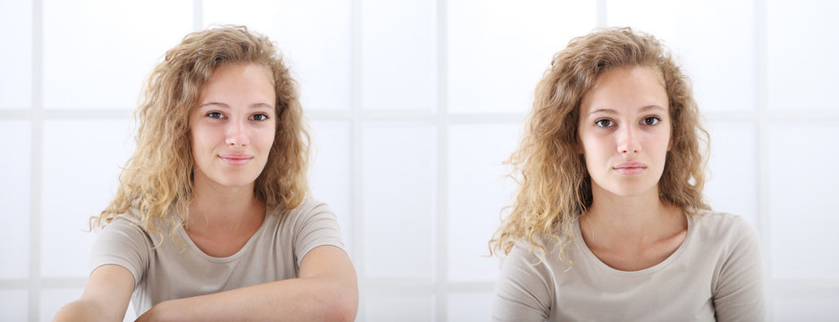 portrait of young casual woman with curly and long red hair isolated on white window background