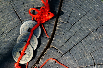 Chinese Feng Shui coin on a wooden surface.