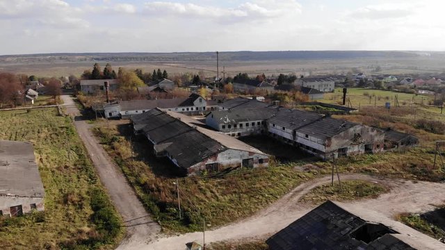 Aerial Drone View Of Abandoned Stables Of The Bankrupt Collective Farm. Pull Out