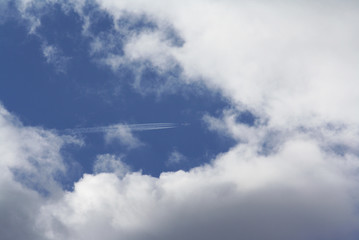 Fototapeta na wymiar Blue Sky White Clouds. Plane