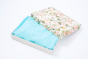 turquoise t-shirt with box on a white background