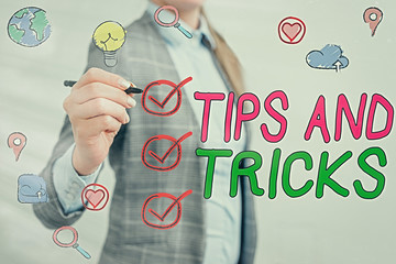 Writing note showing Tips And Tricks. Business concept for piece of inside facts specially in...