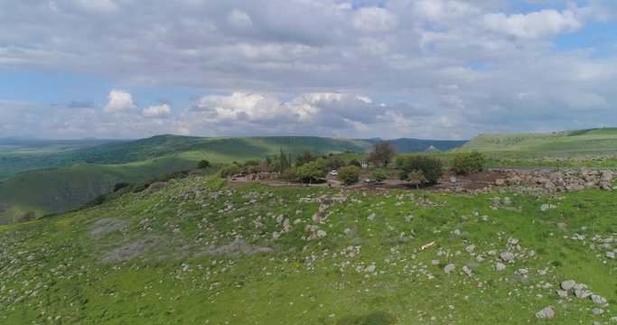 Aerial shot above Golan Heights and Taiberia in North of Israel. Open fields with green landscapes and mountains above Galilee sea or Kinnert at Jordan valley 