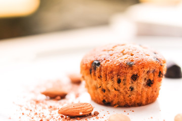 Muffin chocolate lava (banana cake) with chocolate chip, almond and banana smell on white plate for dessert background or texture - homemade concept.