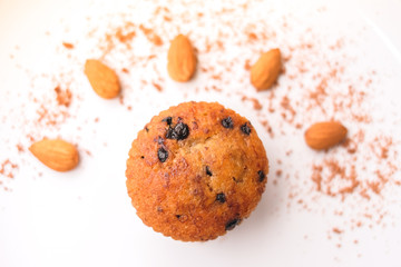 Muffin chocolate lava (banana cake) with chocolate chip, almond and banana smell on white plate for dessert background or texture - homemade concept.