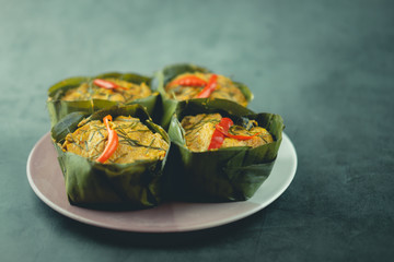 Steamed fish with curry paste on dish