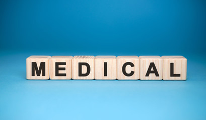 Medical word cube on a blue background. Medical concept.