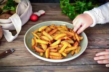 Step by step cooking. Fried potato recipe. Wood background. Dishes from potatoes. Baby eating