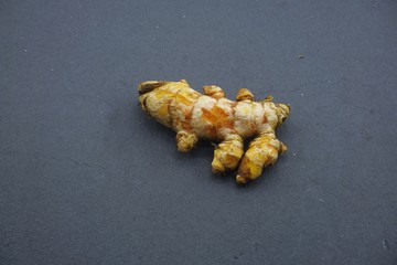 turmeric (Curcuma longa) on a black background.