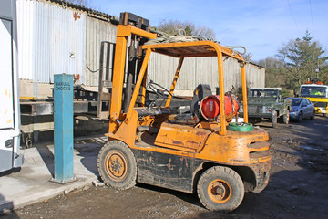 Forklift truck	in a yard