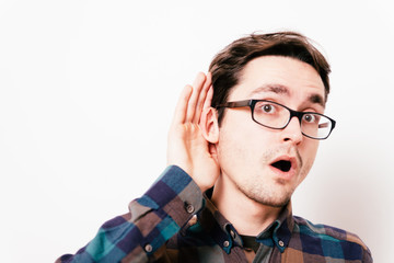 Overhears a man, tries to listen.