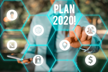Conceptual hand writing showing Plan 2020. Concept meaning detailed proposal doing achieving...