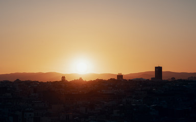 Scenic view of city at sunset against clear sky