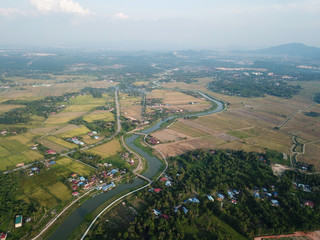 Aerial view Sungai Kulim across the paddy field.