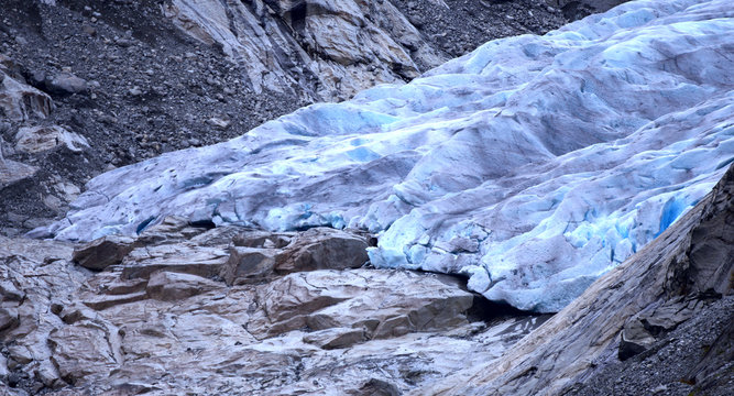 Norwegian glacier with turquoise blue ice affected by climate change