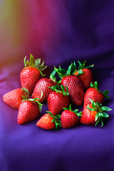 Top of view fresh strawberry on colorful purple background.