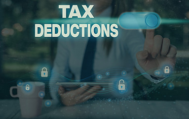 Conceptual hand writing showing Tax Deductions. Concept meaning an amount or cost that subtracted...