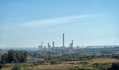 Fototapeta na wymiar refinery on the seashore, the general plan. oil and gas petrochemical industrial, Refinery factory oil storage tank and pipeline steel.