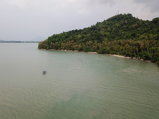 Aerial view a boat near the green scenery island at Batu Kawan, Pulau Pinang.
