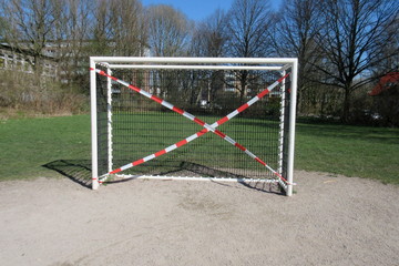Soccer goal blocked due to corona crisis on a playground in a public green area in Hamburg, Germany
