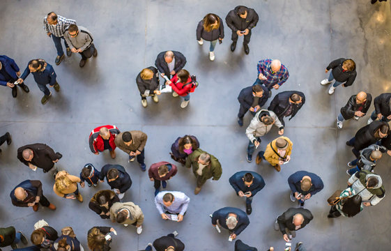 Top view of crowd of people waiting in public place