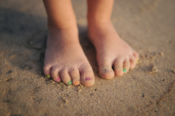 Obraz na płótnie Canvas Baby legs on the sand beach