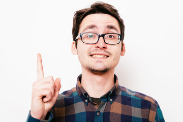 pointing up with his index finger