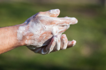 Man's hands are washed with soap. Disinfection prevention of viral diseases