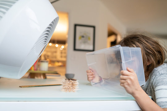 Children testing a toothpick structure with a fan as part of a STEM lesson