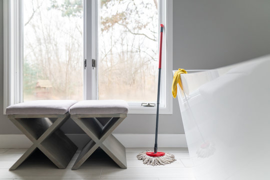 Mop and rags in bathroom for cleaning