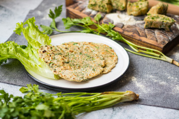 Flatbread with greens and herbs.  Traditional caucasus and Turkish bread.