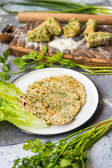 Flatbread with greens and herbs.  Traditional caucasus and Turkish bread.