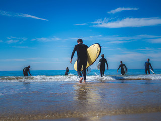 Surfer entering the ocean
