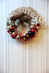 A festive wreath of Christmas baubles as a decoration for Christmas.
