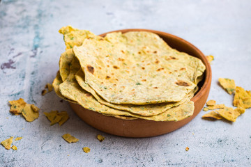 Flatbread chapati, roti or tortillas with herbs. Vegan food. Durum whole wheat bread.